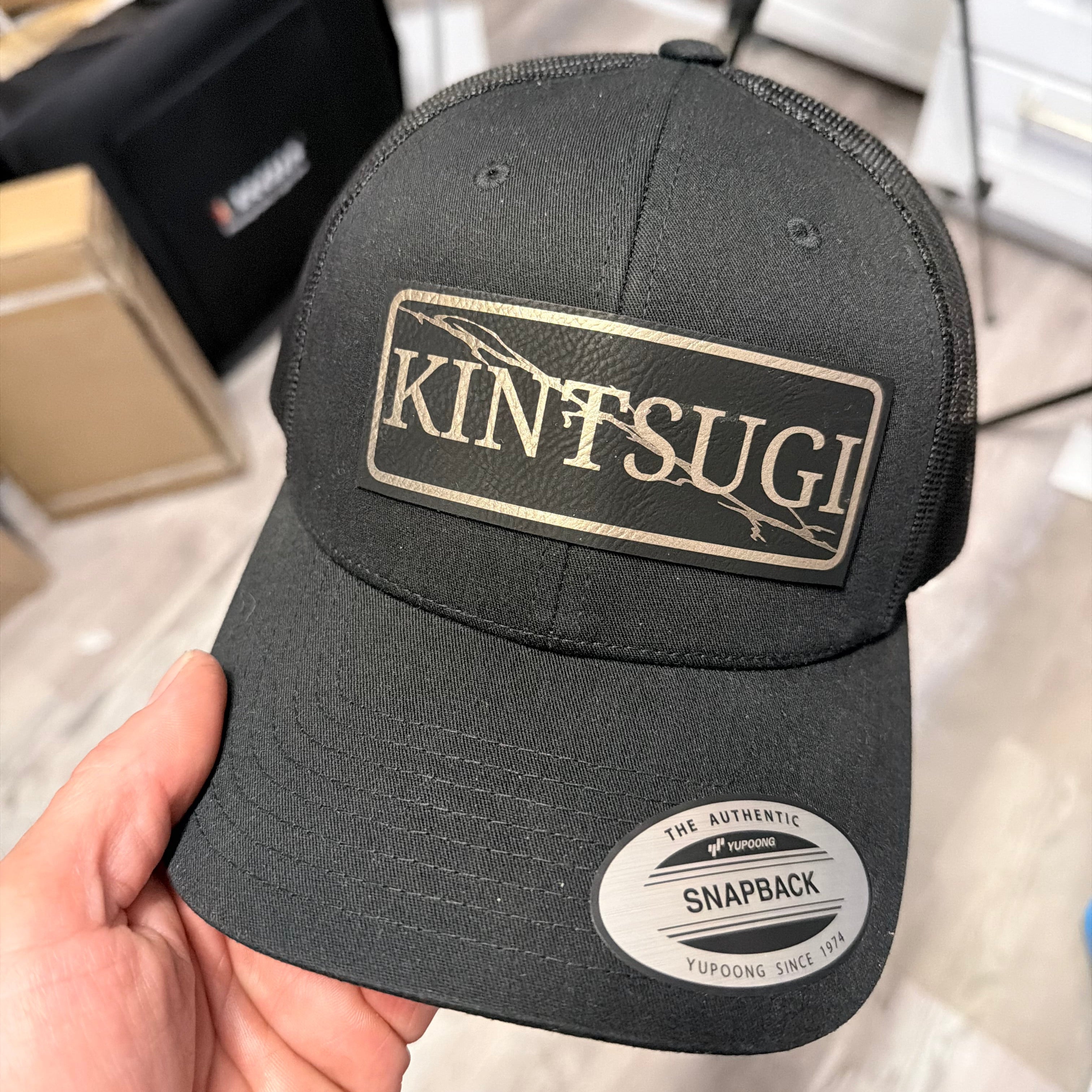 Kintsugi Trucker Hat With Leather Patch Design
